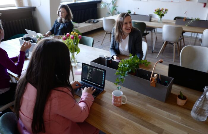 Woman sitting on the chair using laptop